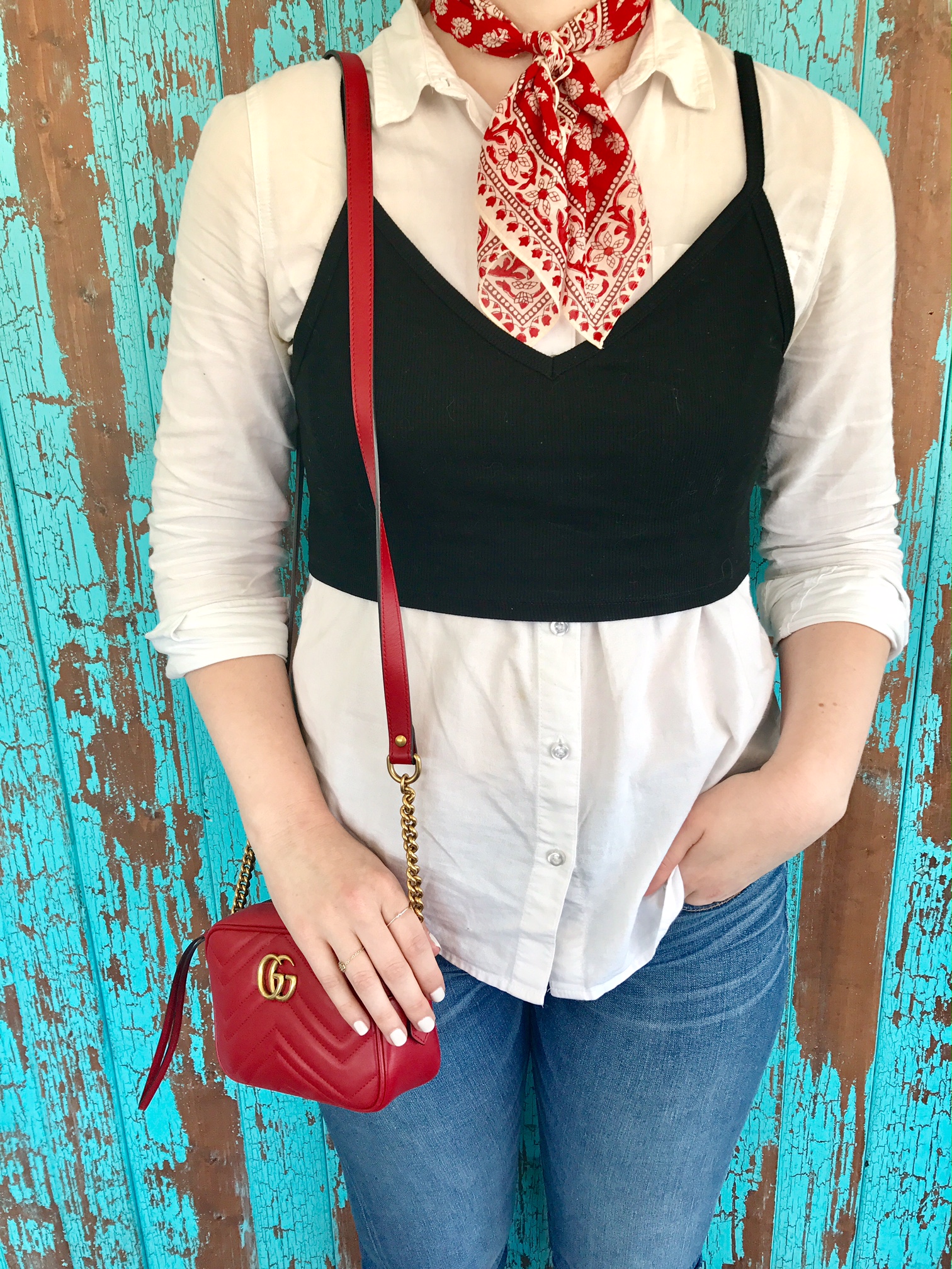 White shirt, black crop top, red bandana neck tie